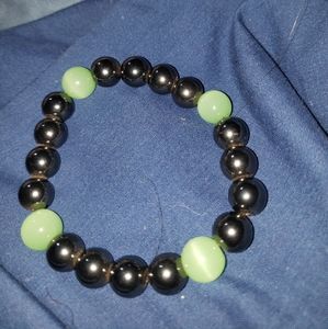 New not used Brazilian Hematite and Actinolite Tigers eye bracelet